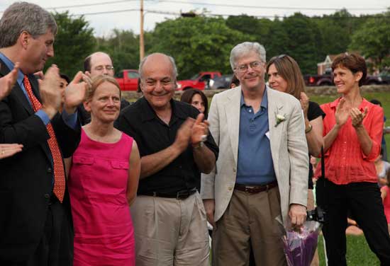 Retiring teachers Thérèse Keoseian and Michael McGarty receive a standing ovation from the audience and students. From left: Steve Finnegan, Thérèse Keoseian, former superintendant Mihran Keoseian, Michael McGarty, Pam Cochrane, and Ann Cohen