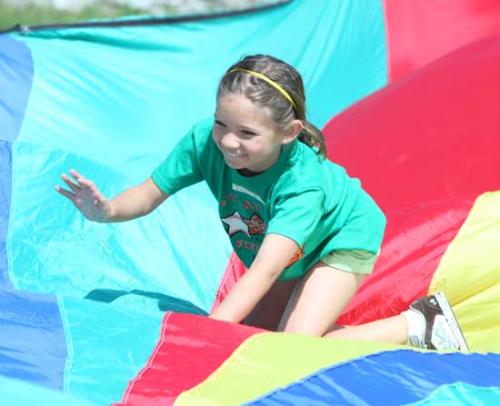 Isabelle Planchet tries to keep her balance on the giant parachute.