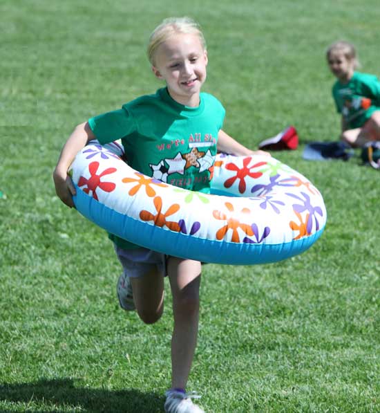 Second-grader Elizabeth Toll participates in a relay race.