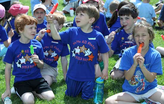 Liam French, Ben Molnar, Christian Heinis, Sam Jackson, and Ainsley Jones devour their popsicles.