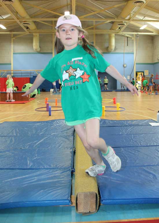 Fiona Morrison tries her skills on the balance beam.