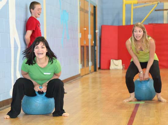 In a silly turn of events, second-grade teachers Dawn-Marie Ayles and Lauren Hurley take to their hippity-hop balls on the home stretch of the obstacle course.