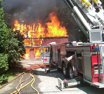 Firefighters battle a blaze at a historic home in Bolton. (Courtesy photo by Bob Mignard) Firefighters battle a blaze at a historic home in Bolton. (Courtesy photo by Bob Mignard)