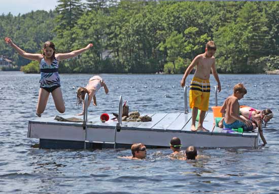 Swimmers jump off “second raft” on a sunny, warm afternoon.