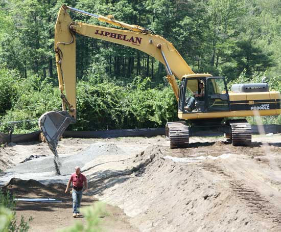 J.J. Phelan and Company works on a stormwater improvement project on the Pond Road field to prevent pollutants washing into Bare Hill Pond.
