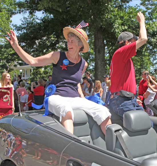 Citizen of Note Lucy Wallace and husband Jim Wallace wave to the crowd along the parade route.