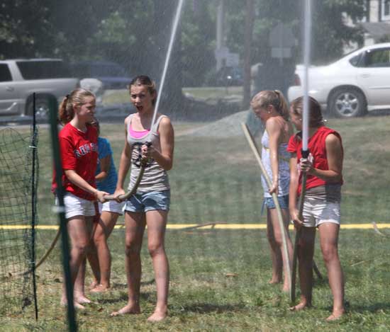 From left, Jackie Duckett, Meghanne Fitzsimmons, Emily Arnold, and Kelsey L’Ecuyer prepare for a water polo match.