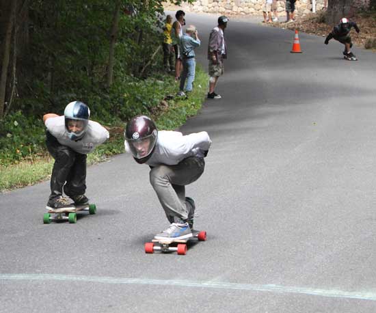 Will Mirando (left) gets edged out of first place by Alex Newton in the downill race.