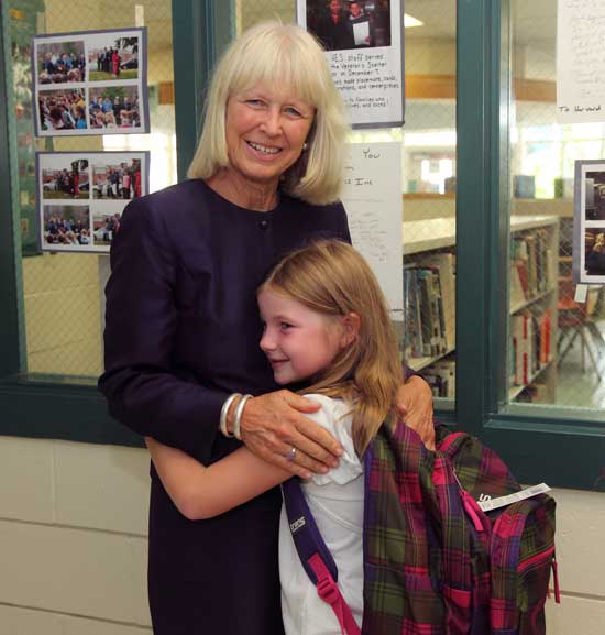HES Principal Suzanne Mahoney gets a hug from Natalie Stoltzfus. Natalie was formerly a student in Shirley where Mahoney was principal until last June.