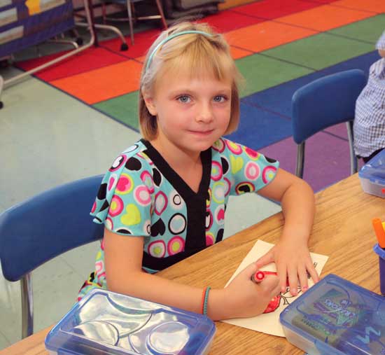 Julia Mara colors on her first day in first grade.