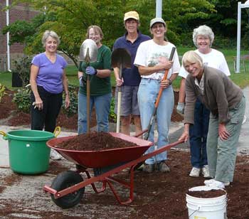 Garden Club crew members pose during a break. From left are Kathy Jackson, Marty Green, Connie Grabowy, Jessie Panek, Barbara Heim, and Carlene Phillips. (Photo by Worth Robbins)