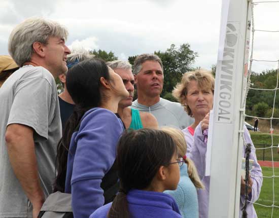 Racers check out the results posted on the goal post.