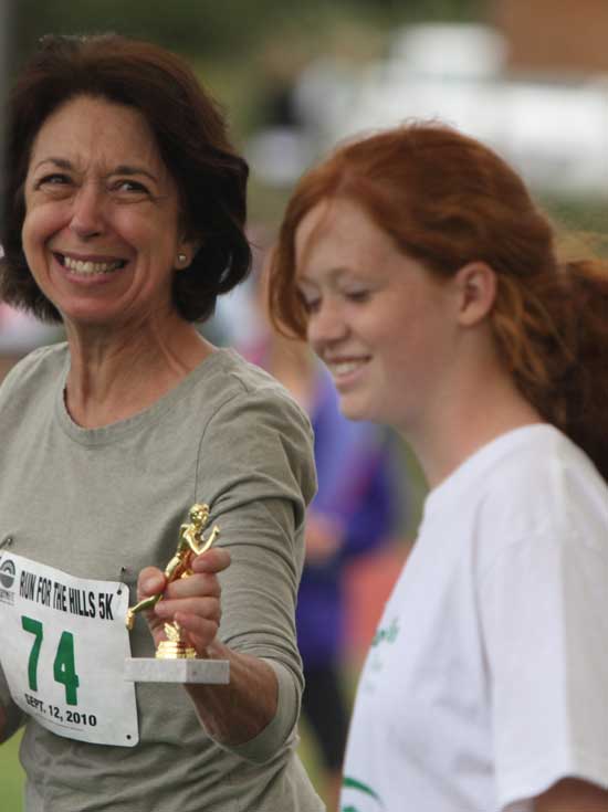 Trudy Lambie (left) accepts her second-place trophy from Evelyn MacMahon.