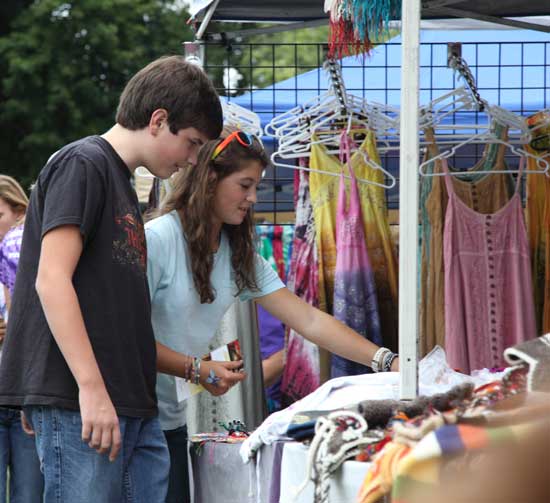 Jake Turchetta and Lexie Dutkewych check out a booth at the craft fair.