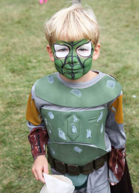 Charlie Hall’s superhero outfit matches his face paint.