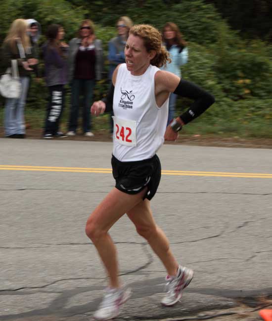 Jen Schoenberg approaches the finish line as the first Harvard female, despite struggling with a heel injury. 