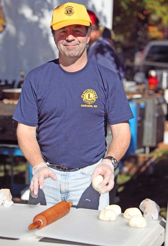 David Cooke prepares to roll out the dough for fried dough at the Lions Club booth. 