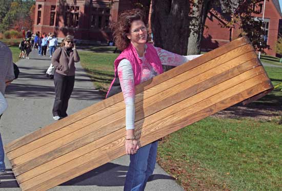 Liza Sullebarger walks off with her find, a toboggan to enjoy this winter’s snow.