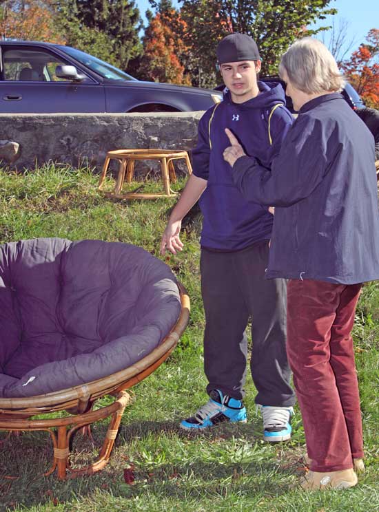 Mike Shaw negotiates with Kathy Hewett for a papasan chair.