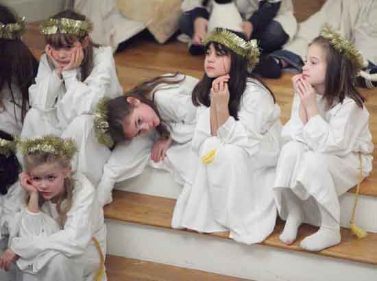 From left, the angel troupe of Alexandra Donahue, Sarah Sobalvarro, Olivia Blair, Jessica DiPietro, and Tori Ferguson relax after their dance.