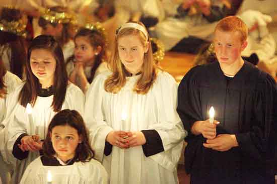 Choir members Jillian Nelson, Alexandra O'Neil, Erin Molinaro, and Hunter Siegrist take part in the Ecumenical Christmas Pageant on Dec. 11.