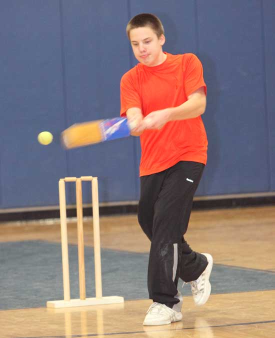 Jonathan Schmidt takes a swing in a game of cricket.