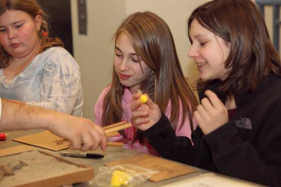 Fom left:  Maggie Gill, Olivia Alfieri, and Emma Hynes work on frames for Zen gardens.