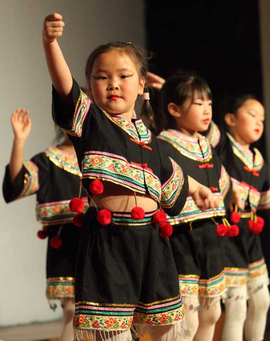 Havard’s Olivia Ren performs a dance of the Yi Ethnic Group of Yunnan Provice in southern China with the Angel Performance Art group of Acton.