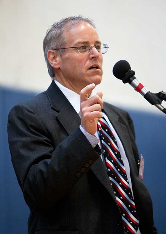 Town Administrator Tim Bragan, sporting a patriotic tie, makes a point.