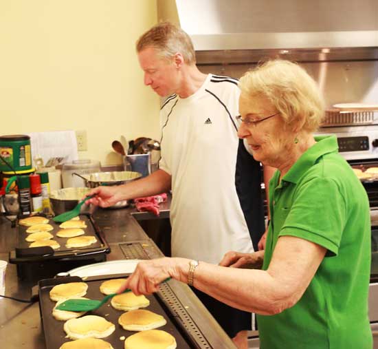 Tom Daniells and Nancy Rifenstein flip pancakes