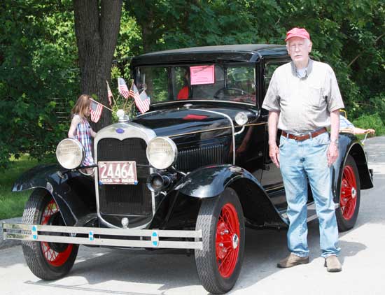 Don Spinney stands by his Model A Ford. Spinney was the first person to enter an antique car in the Fourth of July parade in the 1960s.  (Photo by Lisa Aciukewicz)