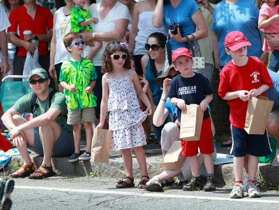 As the parade begins, children are ready with bags to collect candy thrown from floats.  (Photo by Lisa Aciukewicz)