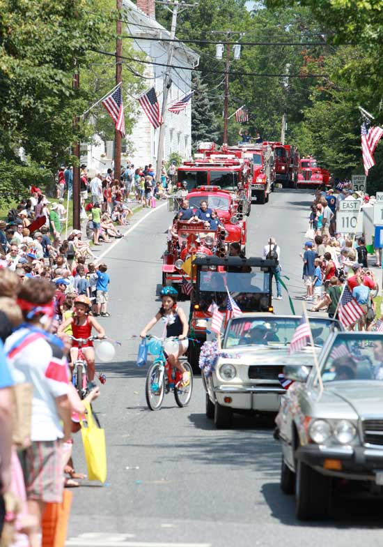  A squadron of fire engines crests the hill of the parade route. (Photo by Lisa Ackukewicz)