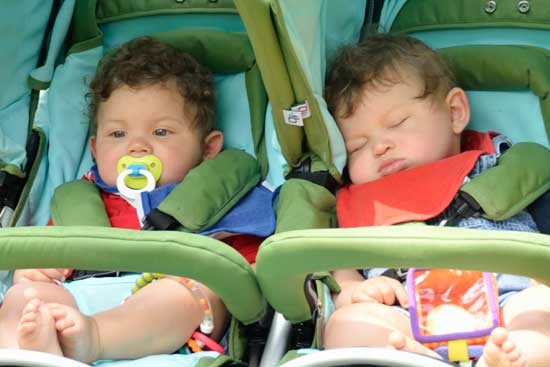 Tatum (left) and Fifer Burgess-Rehm take in the parade (or not!). (Photo by Katy Sharko)