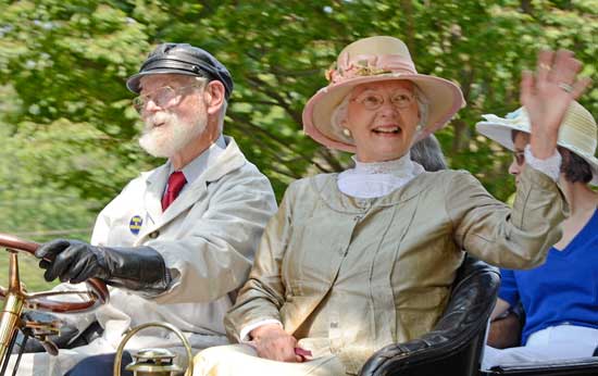 Donald and Marcia Rising interact with the crowd from their antique car. (Photo by John Sharko)
