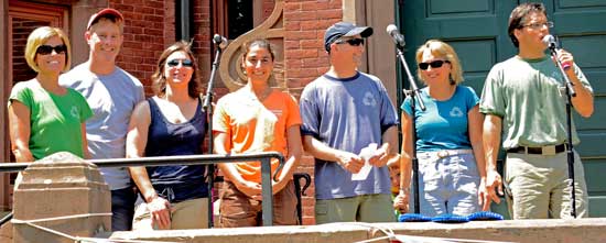 The Fourth of July Committee greets the crowd at the start of the field events. From left: Jill Lee, Colin Dangel, Katie Petrossi, Sandra Kimball, Rich Maiore, Pam Brown, and Frank Anderson. (Photo by John Sharko)