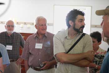 Jonathan Feist (right) tells guests about his home in the former Shaker Meetinghouse. (Photo by Lisa Aciukewicz)