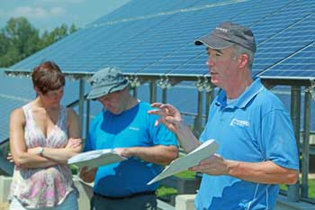 Newell Thomas (right) of Lighthouse Electrical gives a tour and an explanation of the solar array at Carlson Orchards. Newell Thomas (right) of Lighthouse Electrical gives a tour and an explanation of the solar array at Carlson Orchards.