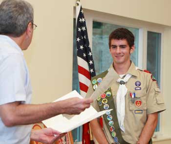 Jack Landry listens to a list of commendations bestowed on him for attaining the rank of Eagle Scout. (Photo by Lisa Aciukewicz) Jack Landry listens to a list of commendations bestowed on him for attaining the rank of Eagle Scout. (Photo by Lisa Aciukewicz)