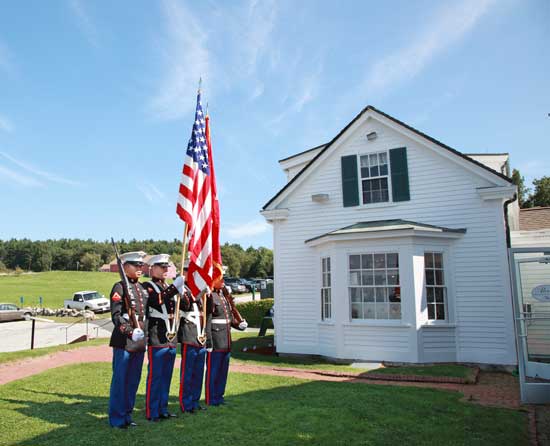 A color guard from the 1st Battalion 25th Marines stands at attention at the entrance to Fruitlands.