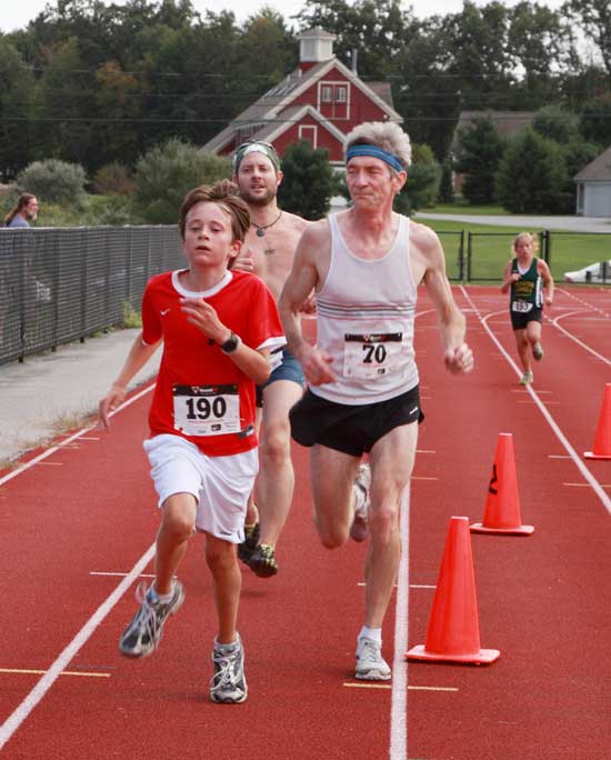 Spencer Davis of Dunstable is a step ahead of Harvard's Dave Kendall.