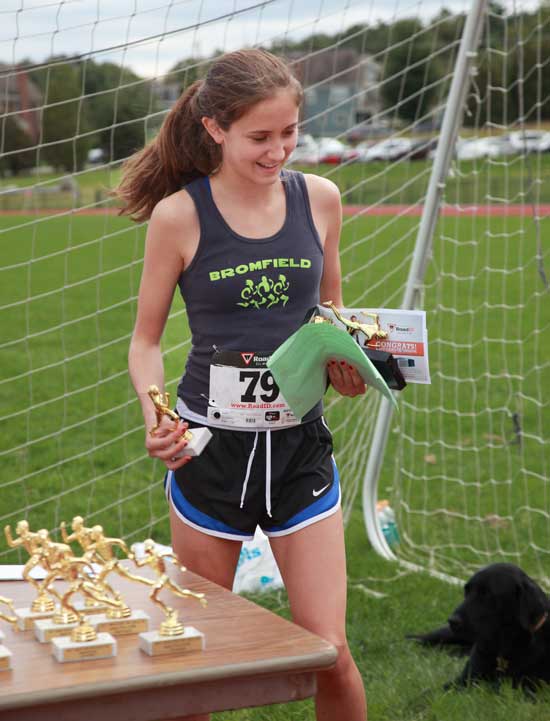 Bromfield sophomore Alexia Lipman picks up trophies for the first female to finish and for the fastest in her age group in the 5K, with a time of 21:58.