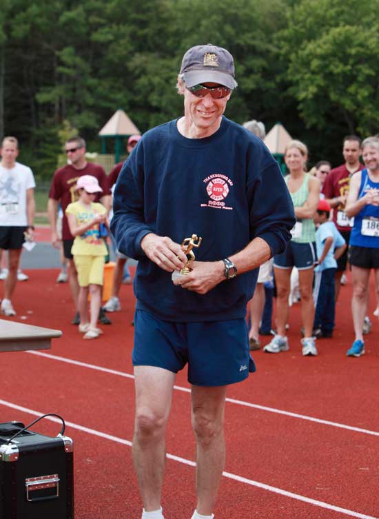 Former race director John Lee is a winner in his age division with a time of 22:44.