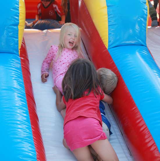 Sigrid Dahlstrom becomes part of a three-child pileup on a slide. 