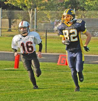 Rebecca Morin (left) covers an offensive player from Quabbin Regional at a Tigers home game on Sept. 19. (Photo by Darcy Robinson)