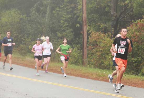 Nick Matisse of Harvard (far right) leads a pack of runners down Prospect Hill Road.