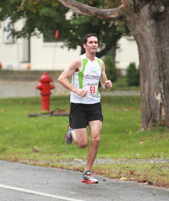 Roy van Cleef sets a steady pace halfway through the race. He would later go on to be the first Harvard resident to cross the finish line in the 10-mile race. 