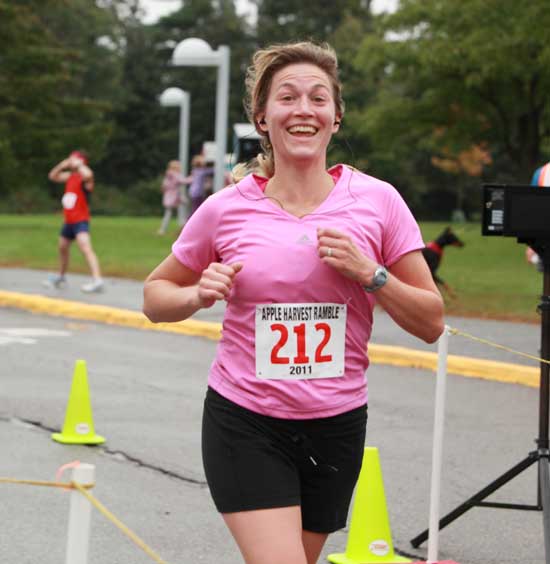 Laura Silk finishes the race with a big smile.