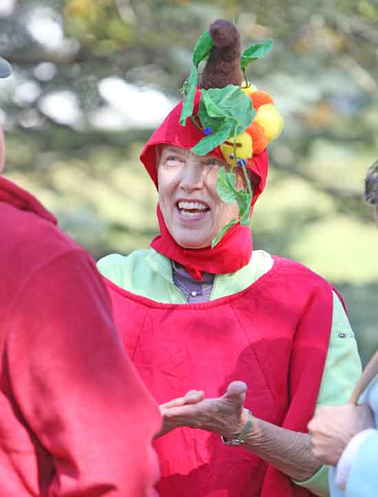 At the Congregational Church Apple Festival, Sue Barber dons an apple costume formerly worn by town legend Ellie Buford.