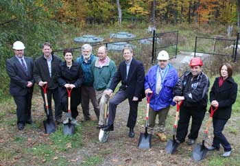 From left: John Potts of Weston & Sampson; David Boyer, Mass DEP; State Representative Jen Benson; Wayne Perry of Norfolk Ram Group; Chair of Town Center Sewer Building Committee Chris Ashley; Selectman Liaison Tim Clark; David Ankener of the State Revolving Fund; Jim Ricciardi, Ricciardi Bros., Inc; and Sewer Commissioner Cindy Russo pose in front of the water treatment plant on Massachusetts Avenue for the Oct. 26 groundbreaking ceremony for the new town center sewer. (Photo by Lisa Aciukewicz) From left: John Potts of Weston & Sampson; David Boyer, Mass DEP; State Representative Jen Benson; Wayne Perry of Norfolk Ram Group; Chair of Town Center Sewer Building Committee Chris Ashley; Selectman Liaison Tim Clark; David Ankener of the State Revolving Fund; Jim Ricciardi, Ricciardi Bros., Inc; and Sewer Commissioner Cindy Russo pose in front of the water treatment plant on Massachusetts Avenue for the Oct. 26 groundbreaking ceremony for the new town center sewer. (Photo by Lisa Aciukewicz)